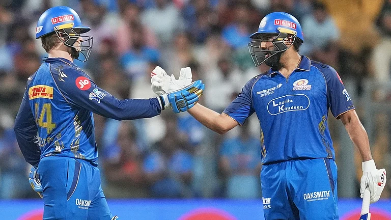 Ryan Rickelton, left, celebrates his fifty with Rohit Sharma during the Indian Premier League match between Mumbai Indians and Lucknow Super Giants in Mumbai. - AP/Rafiq Maqbool