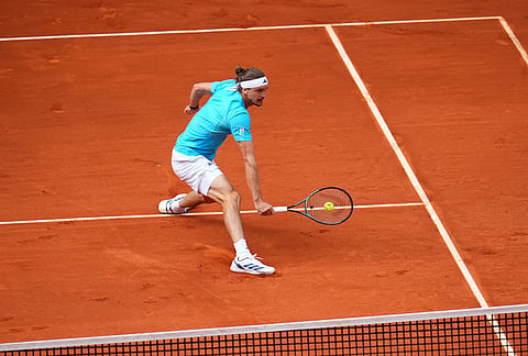 Alexander Zverev, of Germany, returns the ball to Jannik Sinner, of Italy, during their men's singles tennis final match at the Madrid Open tennis tournament in Madrid, Spain.
