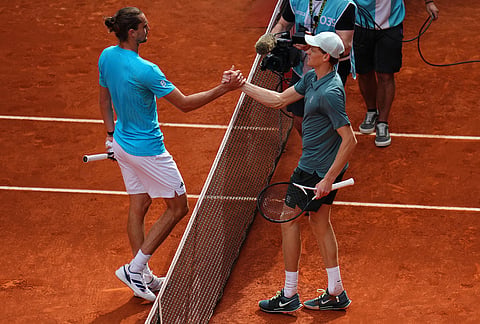 Jannik Sinner, of Italy, right, greets Alexander Zverev, of Germany, after winning the men's singles tennis final match at the Madrid Open tennis tournament in Madrid, Spain.
