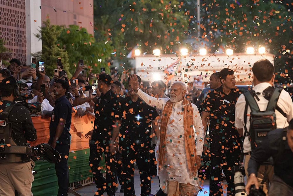 Prime Minister Narendra Modi arrives at the BJP headquarters to celebrate the party's performance in Assembly elections across four states and one union territory, in New Delhi. - Photo: Tribhuvan Tiwari