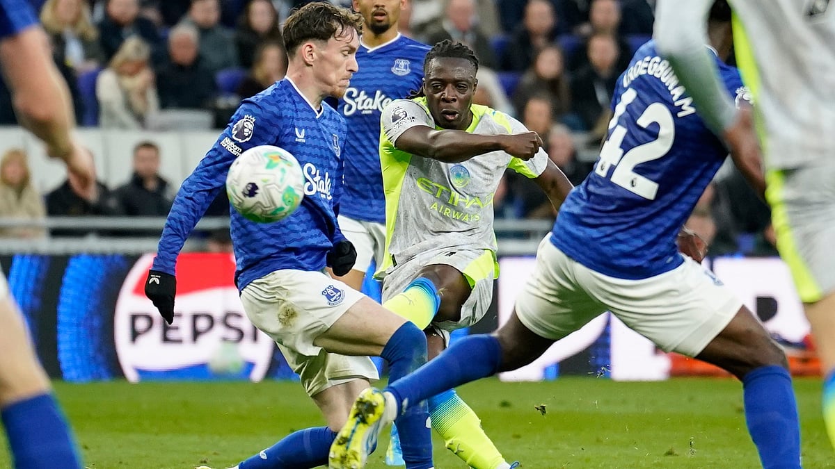 Manchester City's Jeremy Doku scores during the Premier League soccer match between Manchester City and Everton in Liverpool, England - AP Photo
