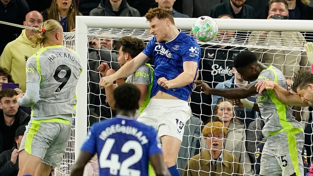 Everton's Jake O'Brien scores during the Premier League soccer match between Manchester City and Everton in Liverpool, England.  - AP Photo