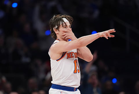 New York Knicks' Tyler Kolek reacts after sinking a three-point basket during the second half of Game 1 in a second-round NBA basketball playoffs series against the Philadelphia 76ers in New York.