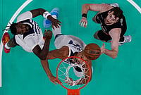 NBA 2026 Conference Semifinals: Minnesota Timberwolves Edge San Antonio Spurs 104–102 In Game 1 | Photo: AP/Eric Gay : Minnesota Timberwolves center Naz Reid, left, center Rudy Gobert, center, and San Antonio Spurs center Luke Kornet, right, eye a rebound during the first half in Game 1 of a second-round NBA playoffs basketball series in San Antonio.