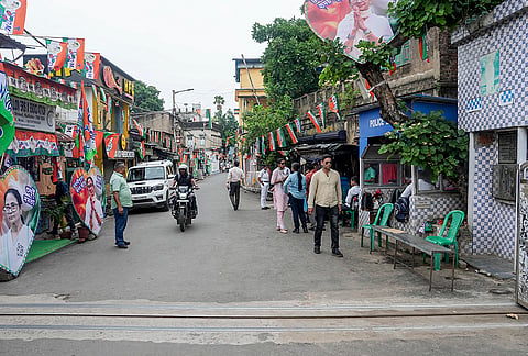 Barricades outside the exit road of TMC supremo Mamata Banerjee’s residence removed, restoring free movement of people following the state Assembly elections result, in Kolkata.