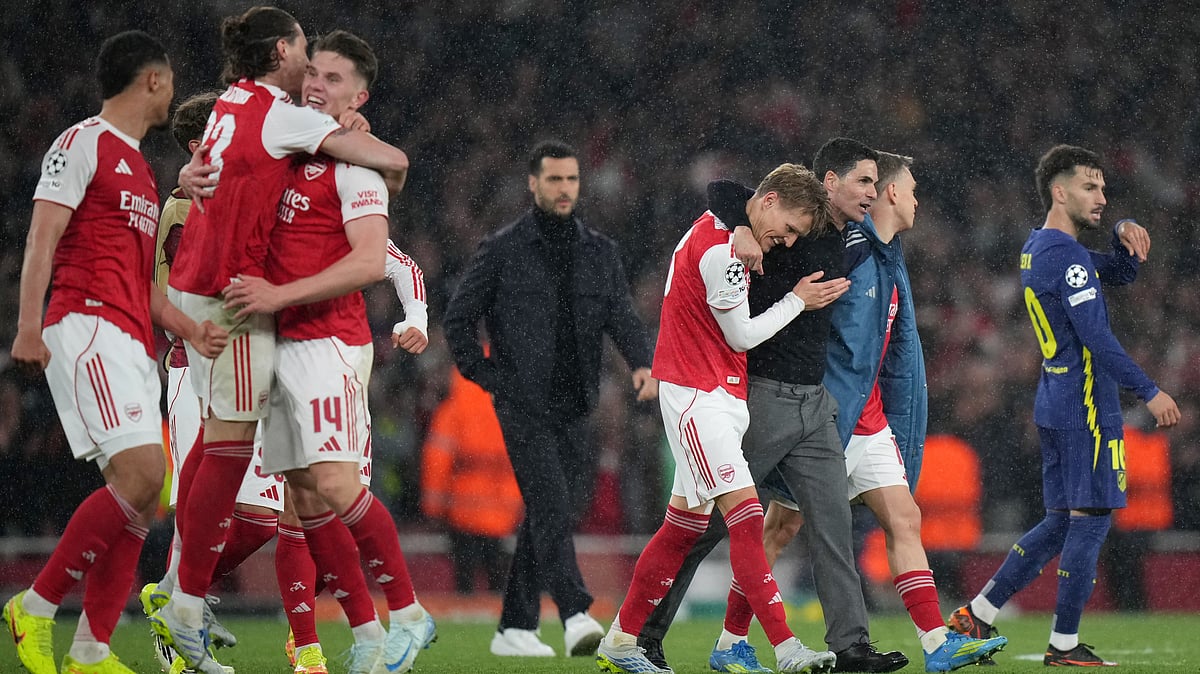 Arsenal's manager Mikel Arteta embraces Martin Odegaard and Leandro Trossard, right, at the the end of a Champions League semifinal, second leg, soccer match between Arsenal FC and Atletico Madrid. - AP Photo