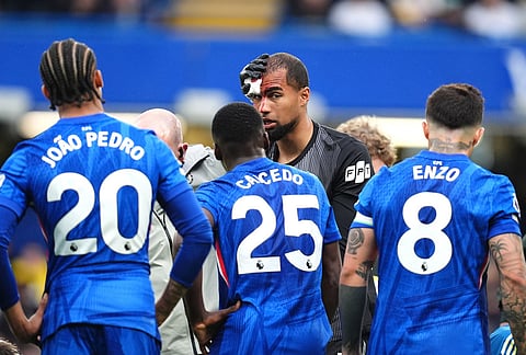 Chelsea goalkeeper Robert Sanchez receives treatment for a head injury during the English Premier League soccer match between Chelsea and Nottingham Forest in London.