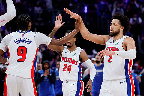 Detroit Pistons guard Cade Cunningham (2) celebrates with guards Ausar Thompson (9) and Daniss Jenkins (24) during the first half in Game 7 of a first-round NBA basketball playoffs series against the Orlando Magic in Detroit.