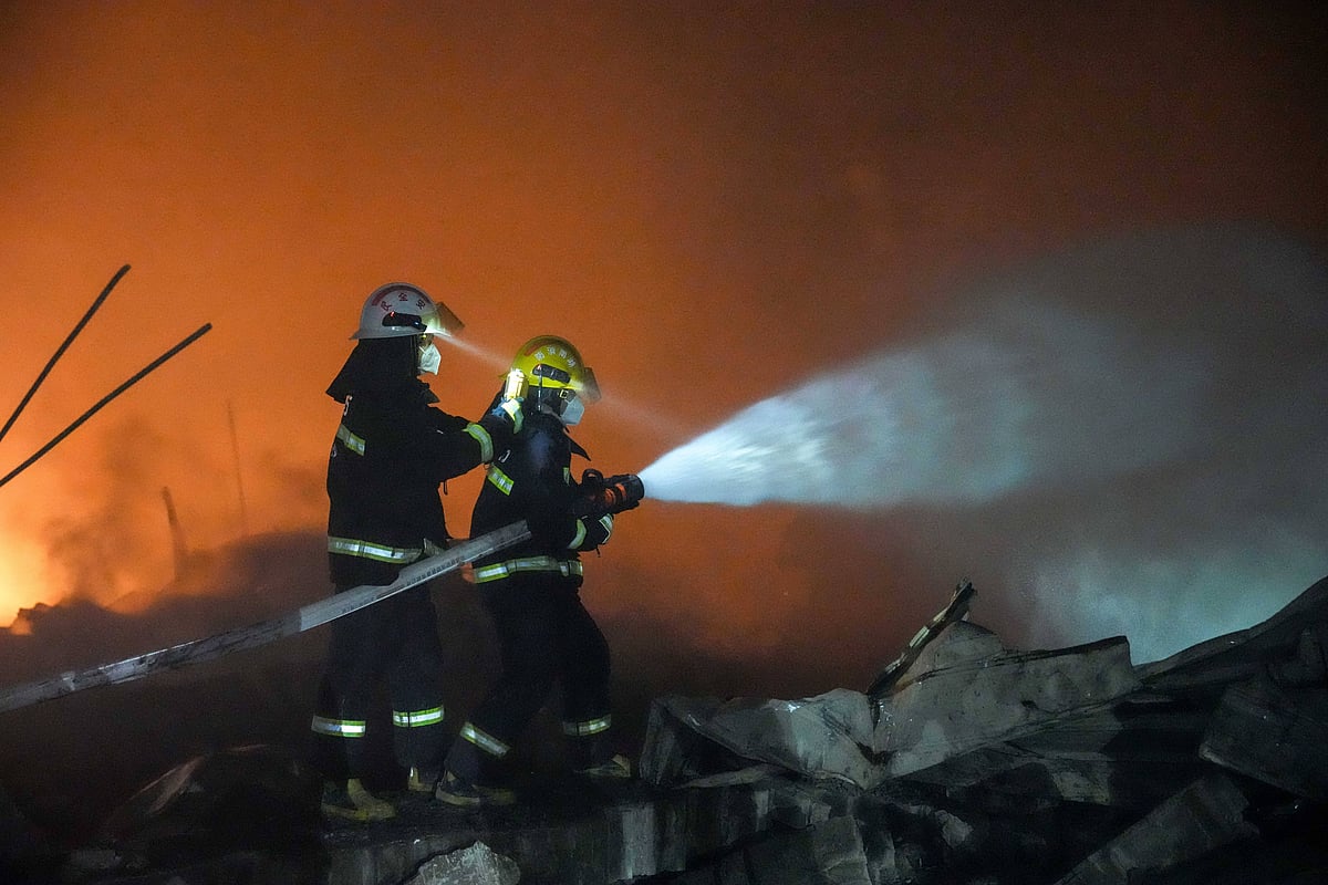 Rescuers work on site after an explosion at a fireworks plant in Guandu Town of Liuyang, central China s Hunan Province, in the early hours of May 5, 2026.  - null