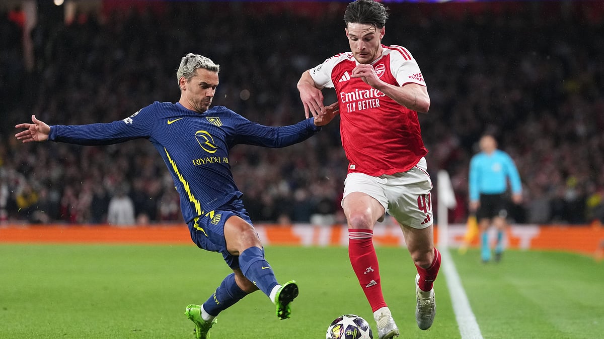 Arsenal's Declan Rice drives the ball past Atletico Madrid's Antoine Griezmann, left, during a Champions League semifinal, second leg, soccer match between Arsenal FC and Atletico Madrid in London. - AP Photo