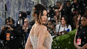 (Photo by Evan Agostini/Invision/AP) : Eileen Gu arrives at The Metropolitan Museum of Art's Costume Institute benefit gala celebrating the opening of the "Costume Art" exhibition on Monday, May 4, 2026, in New York.