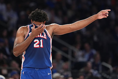 Philadelphia 76ers' Joel Embiid reacts during the first half of Game 1 in a second-round NBA basketball playoffs series against the New York Knicks in New York.