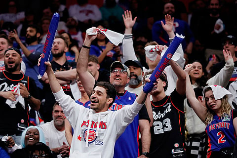 Fans cheer on the Detroit Pistons against the Orlando Magic during the second half in Game 7 of a first-round NBA basketball playoffs series in Detroit.