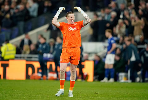 Everton's goalkeeper Jordan Pickford reacts during the Premier League soccer match between Manchester City and Everton in Liverpool, England.