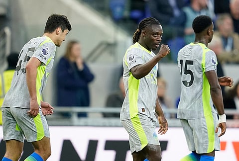 Manchester City's Jeremy Doku celebrates after scoring during the Premier League soccer match between Manchester City and Everton in Liverpool, England.