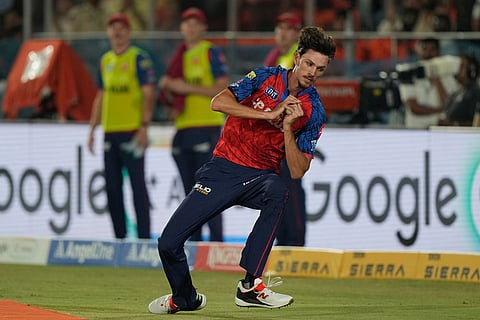 Punjab Kings' Marco Jansen takes the catch to get Sunrisers Hyderabad's Travis Head during the Indian Premier League cricket match between Sunrisers Hyderabad and Punjab Kings in Hyderabad, India.