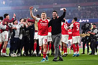 | Photo: John Walton/PA via AP : Arsenal's Leandro Trossard, left, and manager Mikel Arteta celebrate at the the end of a Champions League semifinal, second leg, soccer match between Arsenal FC and Atletico Madrid in London.
