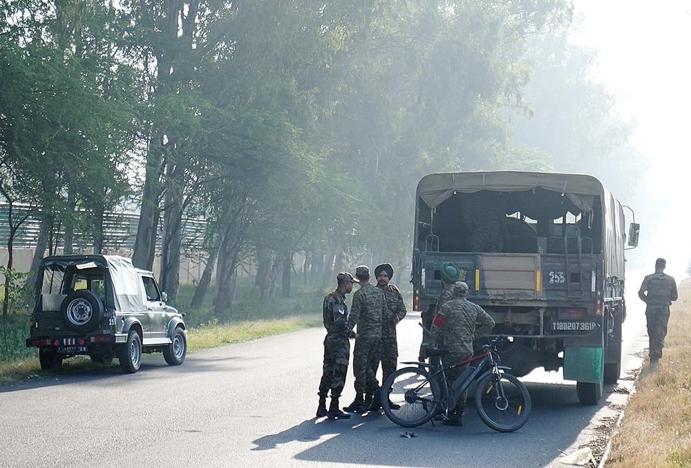 Security personnel remain deployed near the blast site close to the Army cantonment area at Khasa, in Amritsar district. Preliminary investigation suggested that an object was hurled towards the boundary wall, triggering the blast, police said.  - | Photo: PTI/Shiva Sharma