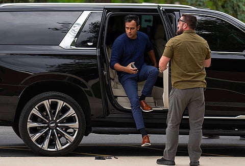 Republican Ohio gubernatorial candidate Vivek Ramaswamy steps out of a vehicle as he arrives to vote at his polling place in Columbus, Ohio during the primary election. 