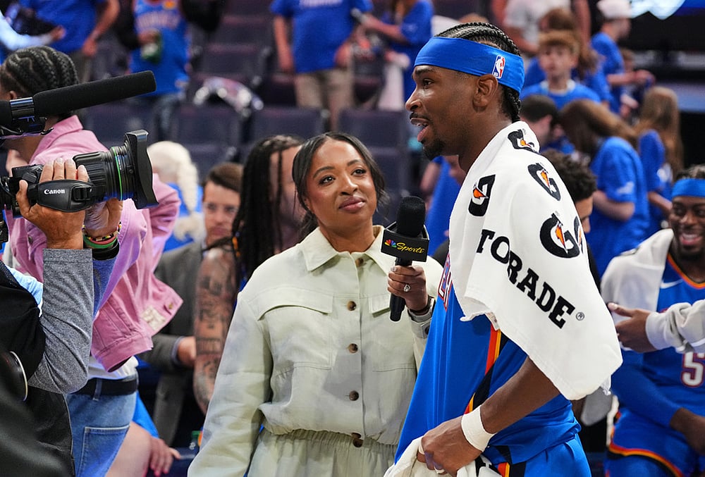 Oklahoma City Thunder guard Shai Gilgeous-Alexander, right, gives a broadcast interview after the team's Game 1 in a second-round NBA basketball playoffs series against the Los Angeles Lakers in Oklahoma City.  - | Photo: AP/Kyle Phillips