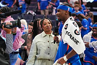 Thunder 108-90 Lakers, NBA 2026: Holmgren Double-Double Powers Hosts In Opener | Photo: AP/Kyle Phillips : Oklahoma City Thunder guard Shai Gilgeous-Alexander, right, gives a broadcast interview after the team's Game 1 in a second-round NBA basketball playoffs series against the Los Angeles Lakers in Oklahoma City.