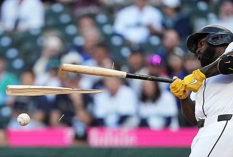 Seattle Mariners' Randy Arozarena breaks his bat as he hits into a force out of Josh Naylor at second base during the second inning of a baseball game against the Atlanta Braves in Seattle. 