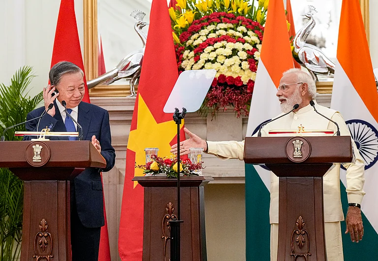Prime Minister Narendra Modi and Vietnamese President To Lam, left, during a joint press statement at Hyderabad House, in New Delhi. - PTI