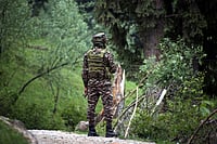 IMAGO : ​
CRPF troop member standing guard in Jammu and Kashmir's Shopian district