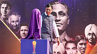 | Photo: PTI/Atul Yadav : Union Minister for Sports Mansukh Mandaviya walks past the covered Men's Junior Hockey World Cup trophy during the Hockey India centenary celebrations, at Major Dhyan Chand National Stadium, in New Delhi.