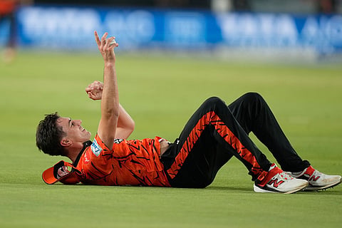 Sunrisers Hyderabad's Pat Cummins takes the catch to get Punjab Kings' Prabhsimran Singh during the Indian Premier League cricket match between Sunrisers Hyderabad and Punjab Kings in Hyderabad, India.