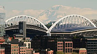 FIFA World Cup 2026: Seattle Stadium To Host Matches In First-Ever Tournament Appearance | Photo: AP/Lindsey Wasson : Mount Rainier is seen in the distance overlooking Lumen Field as seen from Pike Place Market, Saturday, April 25, 2026, in Seattle.
