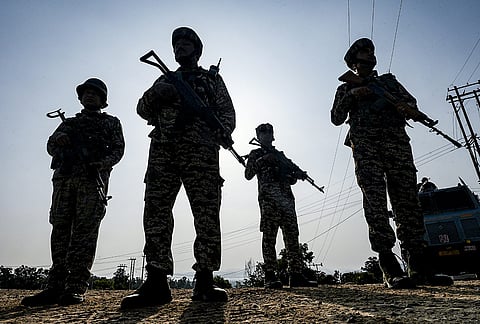 Security personnel stand guard along National Highway-44 on the anniversary of 'Operation Sindoor', in Jammu.