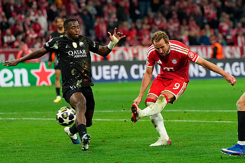 Bayern's Harry Kane scores his side's first goal during the Champions League semifinal second leg soccer match between Bayern Munich and Paris Saint Germain in Munich, Germany.