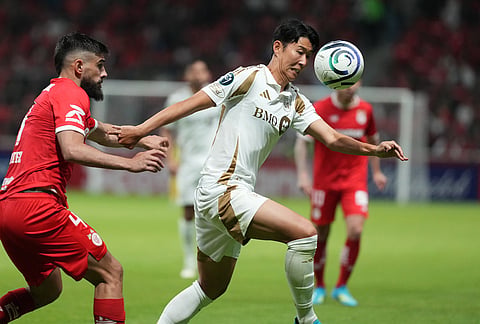 Son Heung-Min of the United States' Los Angeles FC, right, and Bruno Mendez of Mexico's Toluca vie for the ball during a CONCACAF Champions Cup second leg semifinal soccer match in Toluca, Mexico.
