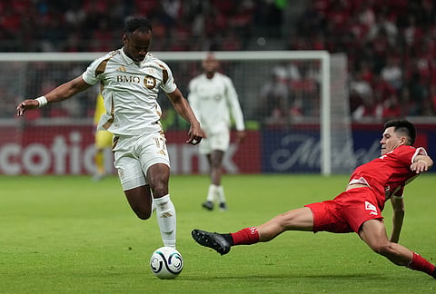 Pavel Perez of Mexico's Toluca, right, challenges Jeremy Ebobisse of the United States' Los Angeles FC during a CONCACAF Champions Cup second leg semifinal soccer match in Toluca, Mexico.