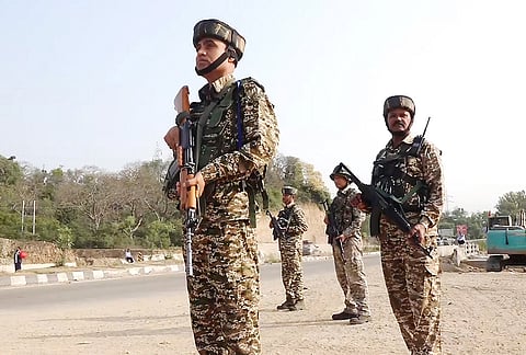 Security personnel stand guard along National Highway-44 on the anniversary of 'Operation Sindoor', in Jammu.