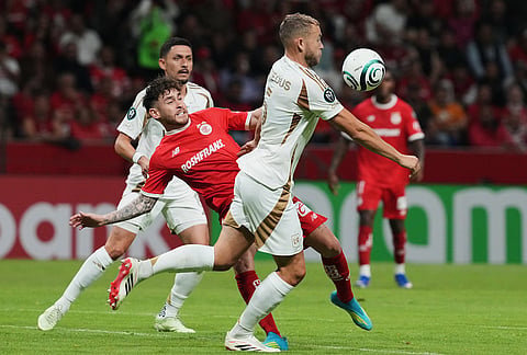 Ryan Porteous of the United States' Los Angeles FC, front, and Jesus Angulo of Mexico's Toluca vie for the ball during a CONCACAF Champions Cup second leg semifinal soccer match in Toluca, Mexico.