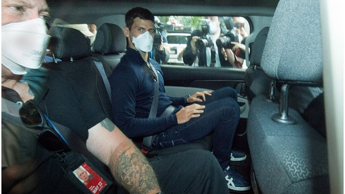 Novak Djokovic leaves a government detention facility to attend a court hearing.