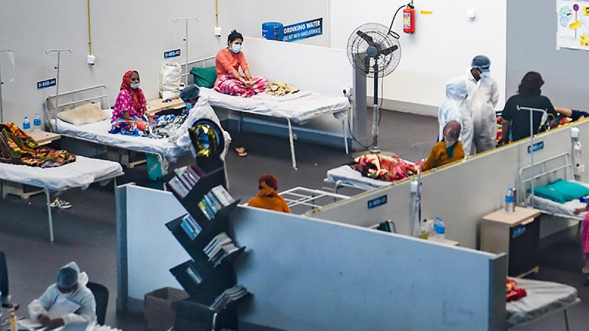 Medics wearing PPE suit take care of patients at the Jumbo Covid Care Centre in Vashi, Navi Mumbai. 