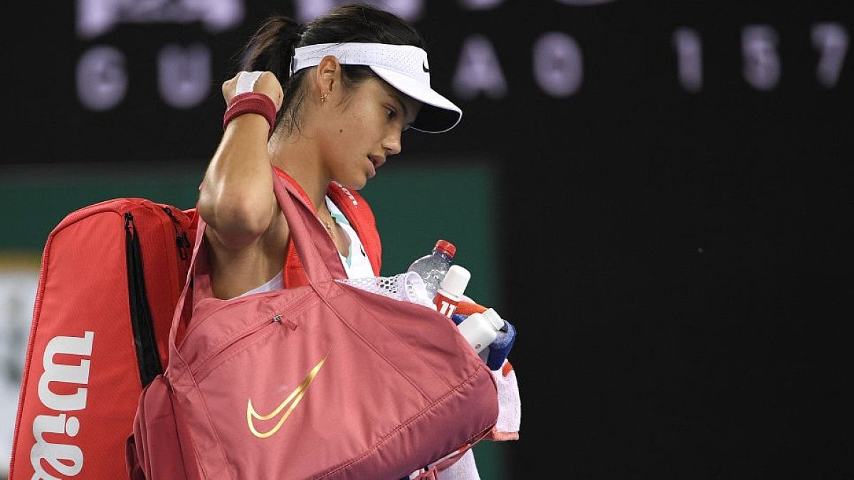 Emma Raducanu of Britain walks from the court after losing to Danka Kovinic at Australian Open 2022.