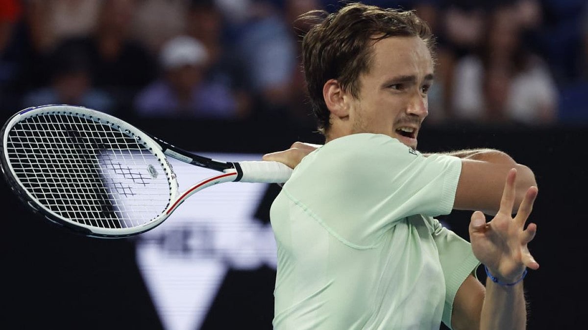 Daniil Medvedev plays a forehand return to Nick Kyrgios at Australian Open 2022.