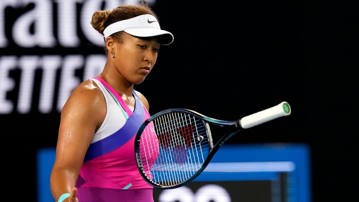 Naomi Osaka reacts after her third-round loss to Amanda Anisimova in Australian Open 2022.
