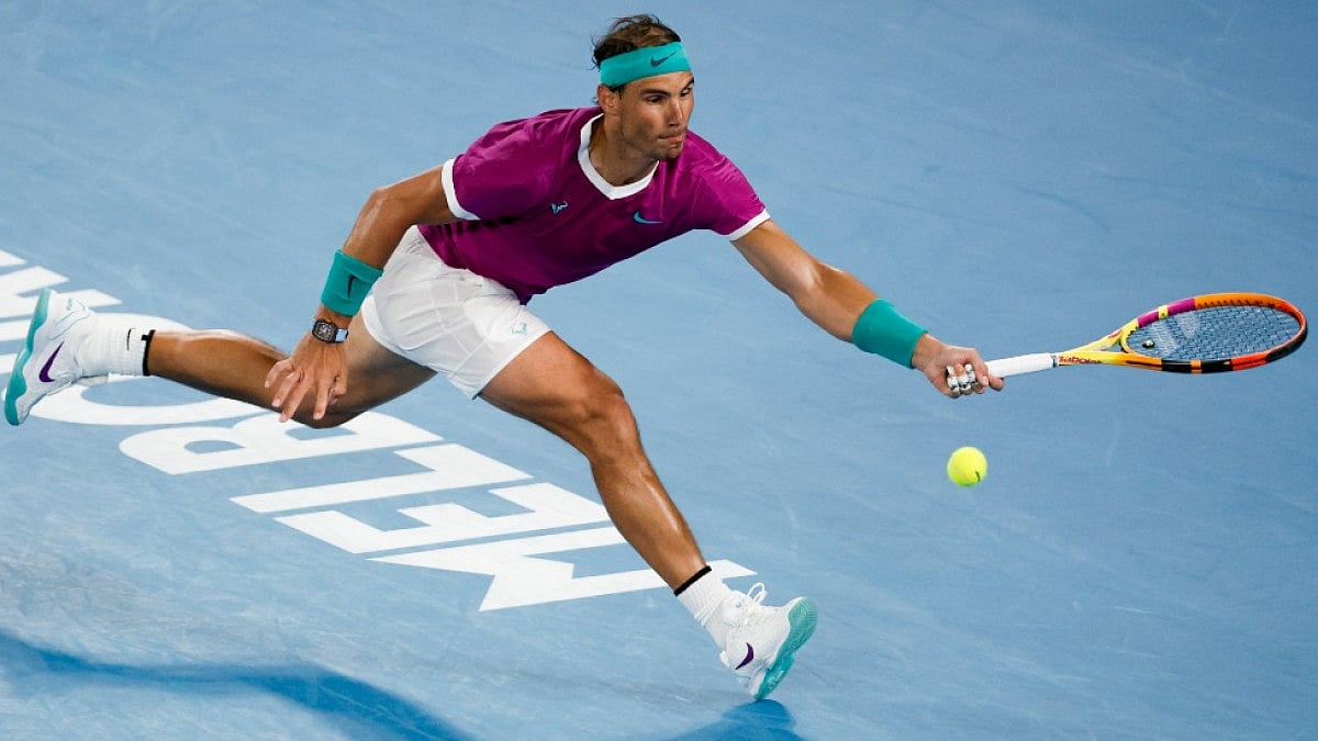 Rafael Nadal plays a forehand return to Karen Khachanov at the Australian Open 2022.