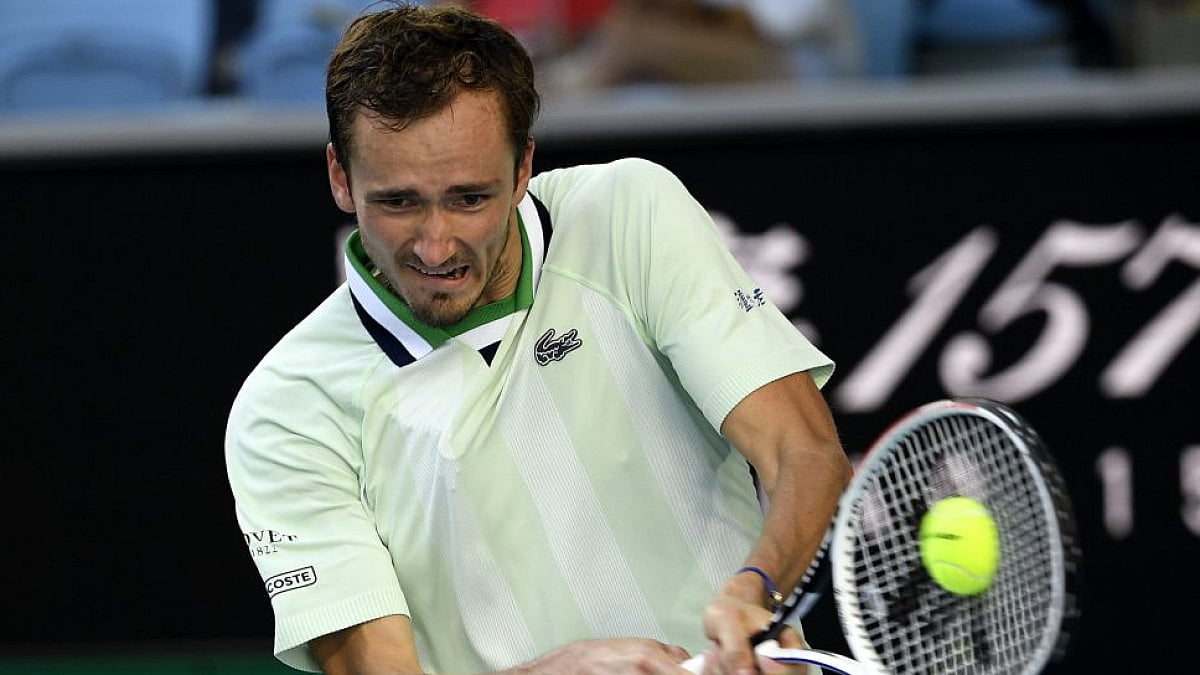 Russia’s Daniil Medvedev plays a backhand return to Botic van de Zandschulp at Australian Open 2022.