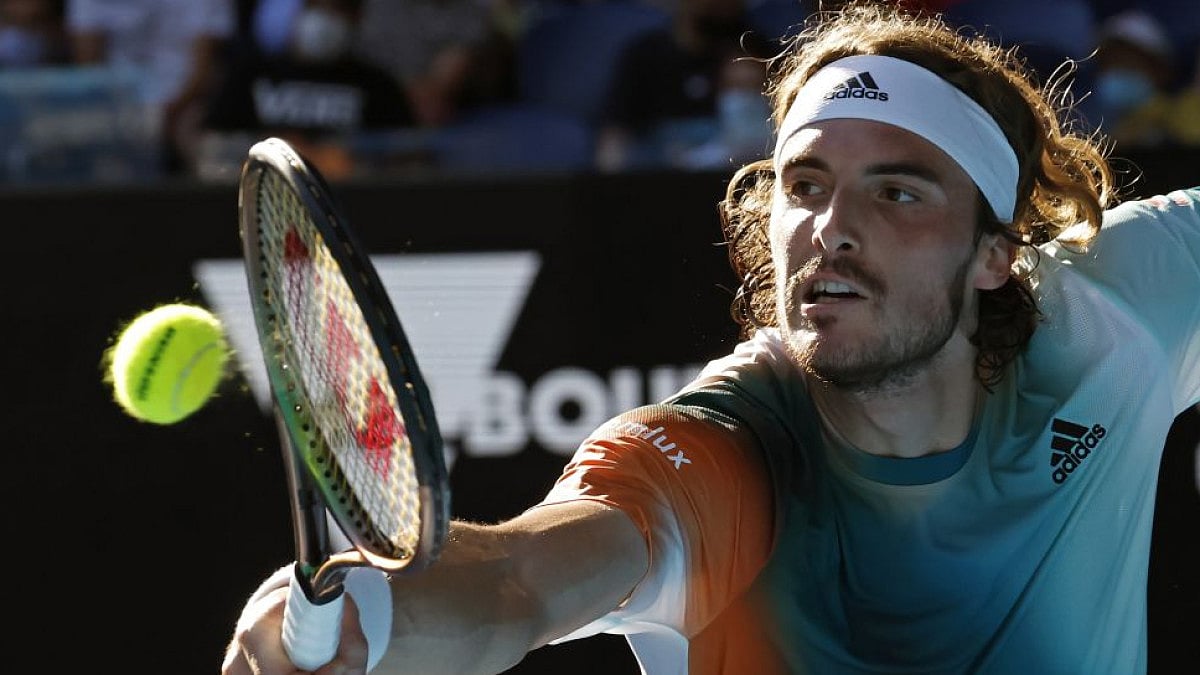 Stefanos Tsitsipas plays a backhand return to Benoit Paire in third round of Australian Open 2022.