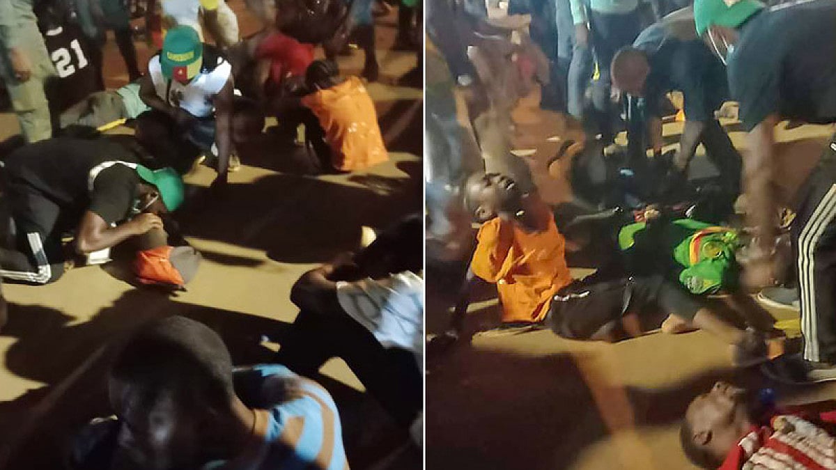 People assist victims of a stampede outside a stadium hosting an African Cup of Nations match.