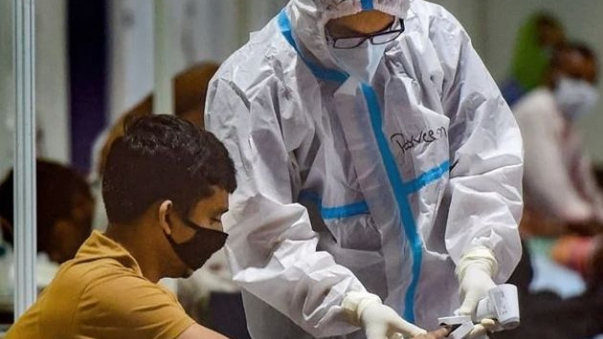 A health worker checks pulse rate of a patient. (Representative image)
