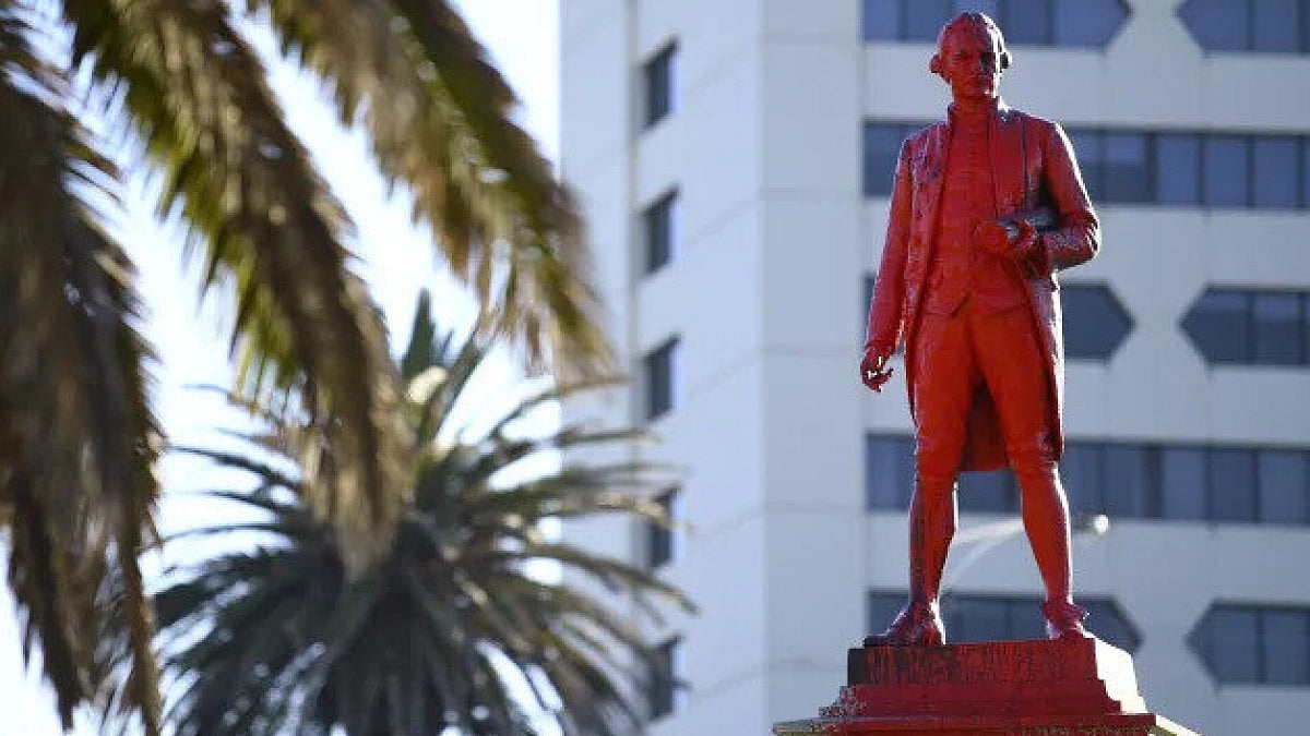 Red paint covers a statue of Captain James Cook after it was vandalized in Melbourne