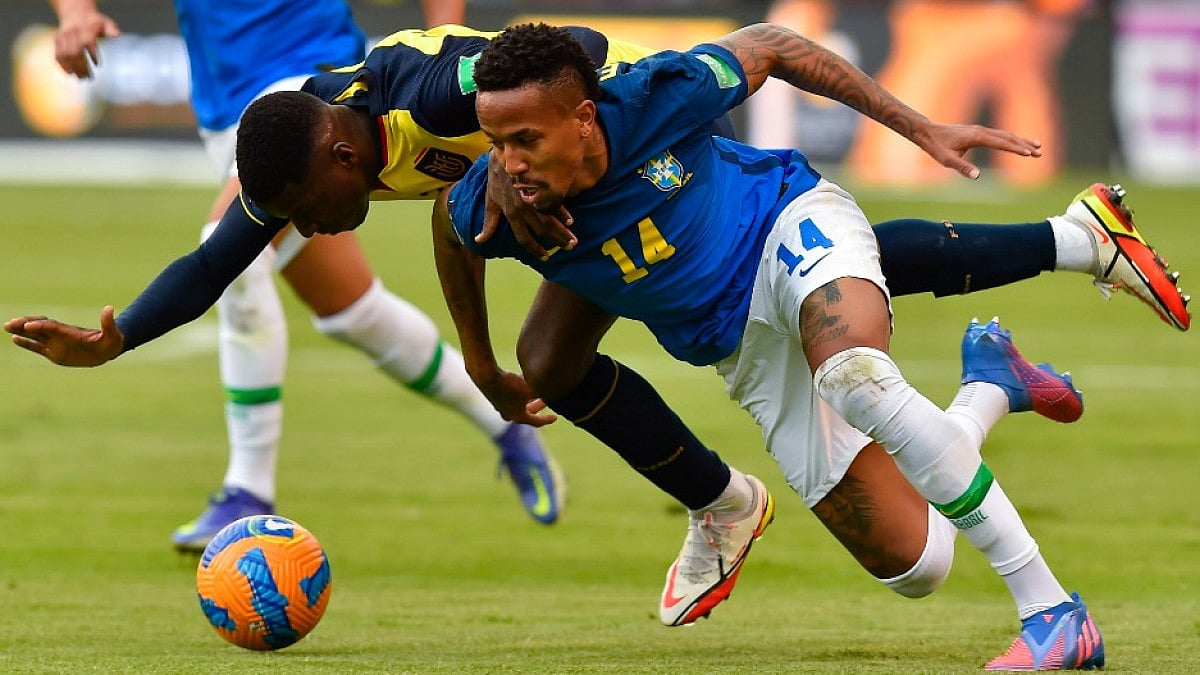 Ecuador's Enner Valencia (L) and Brazil's Eder Militao at the 2022 FIFA World Cup Qualifiers.