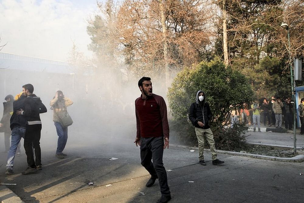 Iran Unrest Continues, Protesters Try To Overrun Military Bases, Police Stations, At Least 13 Dead